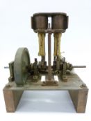 A part finished twin cylinder live steam engine,