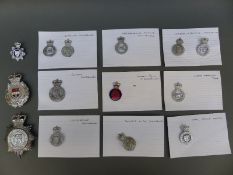 A collection of various police badges including West Mercia Constabulary, Leicester and Rutland,