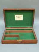 A wooden pistol / revolver box with fitted felt lined interior and label for Deane Adams and Deane,