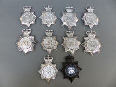 Ten police helmet badges including Notinghamshire Combined Constabulary, Essex and Southend-on-Sea,