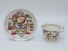 An early 19thC porcelain cup and saucer, possibly Swansea/Nantgarw,