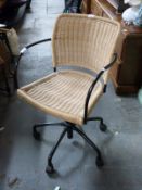 A wicker swivel chair