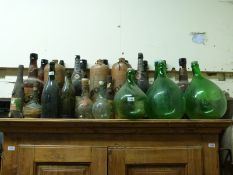 A large collection of point of sale and similar champagne bottles including Bols and Babycham