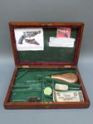A brass inlaid wooden pistol / revolver box with fitted felt lined interior,