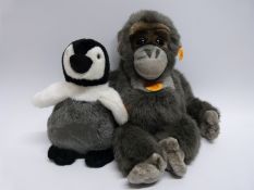 Two Steiff teddy bear animals Charly Penguin 057083 and Baby Gorilla 062070