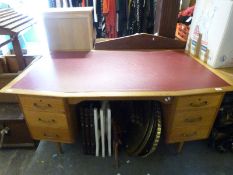 A retro leather inset mahogany twin pedestal desk of canted form on turned tapering legs (W166 x