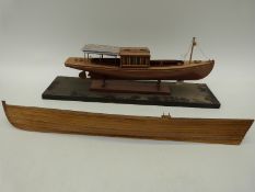 A wooden model of an Edwardian boat together with a similar model rowing boat