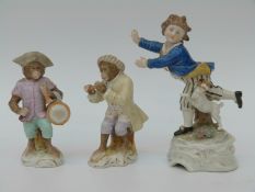 Two Meissen style monkey band figures and another figure bearing beehive mark