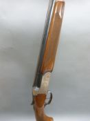 Maestro 20 bore over and under ejector shotgun with, ornate scrolling engraving, 28inch barrels,