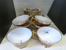 Royal Crown Derby Bird of Paradise pattern teaware including six trios and a cake plate