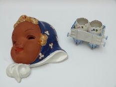 Goldscheider style face mask and a continental cruet in the form of a railway carriage