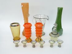 A collection of retro coloured glassware including a liqueur set