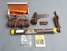 A collection of gun accessories including Nikko Sterling rifle scope mount rings,