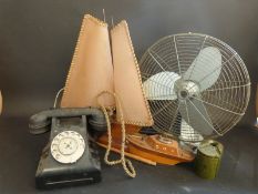 A c1960's black bakelite telephone, c1950's wooden boat lamp and cigarette lighter,