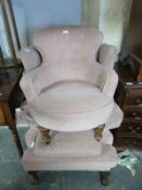 A 19th/20thC mahogany upholstered wing back chair and a pink upholstered nursing chair.