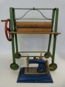 A Tri-ang child's / doll's mangle together with a miniature Casige sewing machine