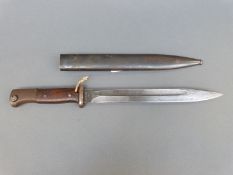 A WWII German bayonet with serial no 9630 with scabbard marked S/185K