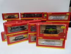 Twenty-four Hornby 00 gauge carriages and wagons,