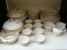 A tea set and part dinner service with tureens in floral design.
