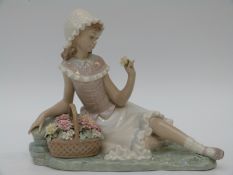 Lladro figurine of a girl with flowers