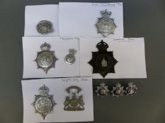 A collection of police badges including Gateshead, Bolton County Borough, Burnley,