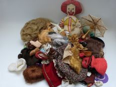 A collection of dolls, clothes,
