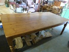 A large pine farmhouse style table and eight (6 and 2) beech chairs (H77 x L245 x W120cm)