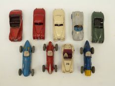 Nine Dinky Toys diecast model racing and sports cars together with a quantity of tyres,