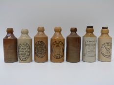 Seven stoneware bottles including Salford,