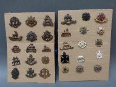 A collection of 50 British army officer's collar badges,