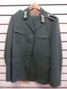 An Eastern European police officer's uniform comprising tunic and trousers
