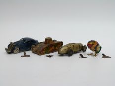 Three tinplate clockwork model vehicles comprising a DRGM (Gama) tank,