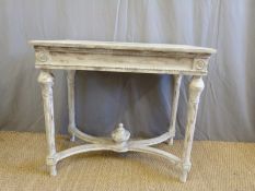 A shabby chic style console/side table raised on reeded legs united by curved stretchers (W90 x D53