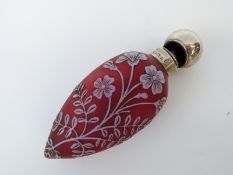 Victorian teardrop shaped cameo glass scent bottle with white overlaid decoration of flowers and