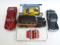 Five Burago and Maisto diecast model cars,