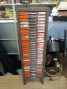 A 30 drawer cabinet with sectional drawers containing a very large quantity of fishing flies,