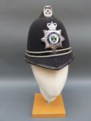 A Thames Valley police helmet and a States of Jersey example