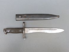 A Spanish Bolo bayonet impressed 5051 to blade in metal scabbard