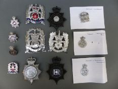 A collection of various police badges including Hampshire Constabulary, Isle of Wight,