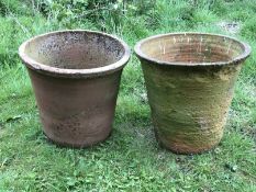 Two terracotta garden plant pots.