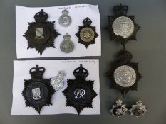 A collection of police badges including Oxfordshire Constabulary and Oxford City Police