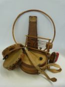 A collection of wooden children's toys including a trundling hoop,