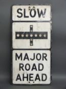 A vintage pressed aluminium 'slow major road ahead' road sign with honeycomb style reflections,