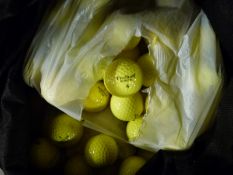 Approximately 150 yellow golf balls