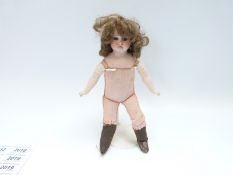 Armand Marseille bisque headed doll with open mouth, fixed brown eyes, curly brown hair,