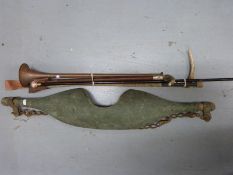 Three vintage riding crops, a walking cane with ceramic top,