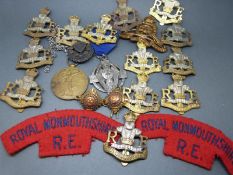 A quantity of cap badges,