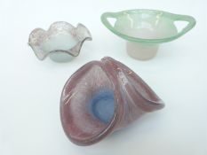 Three pieces of Vasart glass comprising a twin handled bowl of green over pink colouration (16.