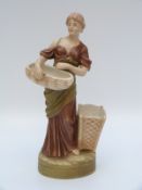 Royal Dux figurine of a girl with basket decorated in typical shot silk colours (25cm tall)