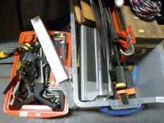A large quantity of tools including clamps, saws,